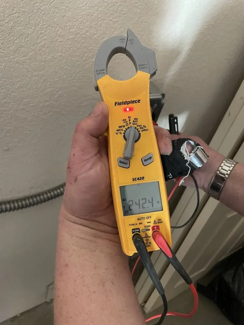 Voltage testing with clamp meter during Ceiling Fan Installation in Earl